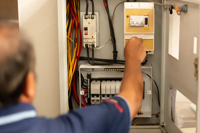 Inspector examining a residential electrical panel